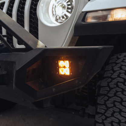 heretic quattro led fog light kit for jeep rubicon in amber mounted on a jeep 